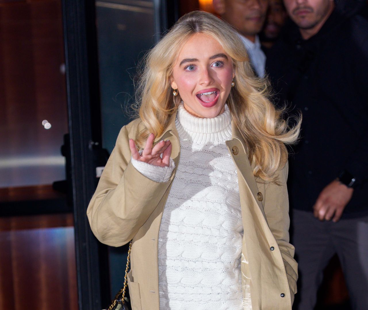 Sabrina Carpenter in Cream Sweater and Heels
