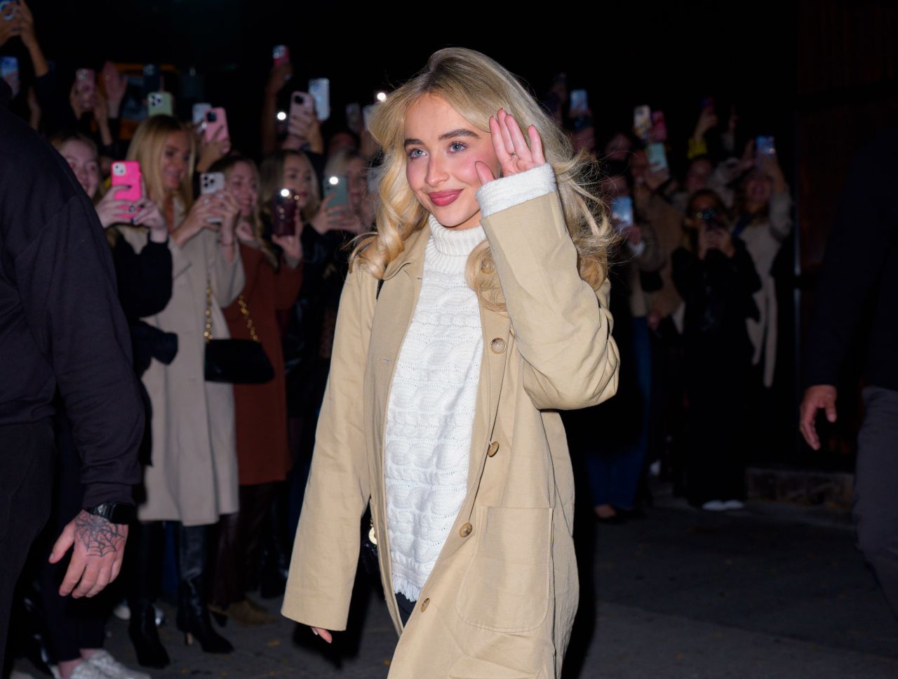 Sabrina Carpenter in Cream Sweater and Heels