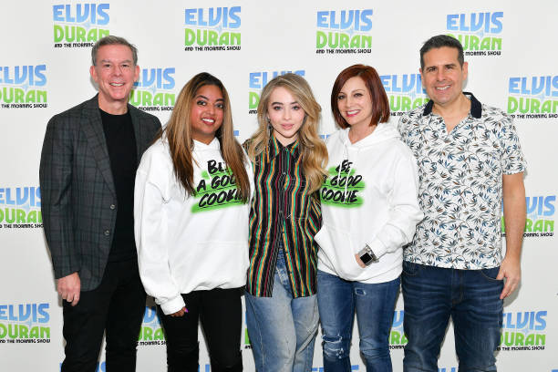 Sabrina Carpenter poses with Elvis Duran, Medha Gandhi, Danielle Monaro, and Skeery Jones during her visit to "The Elvis Duran Z100 Morning Show" at Z100 Studio on March 12, 2019 in New York City. (612×408)