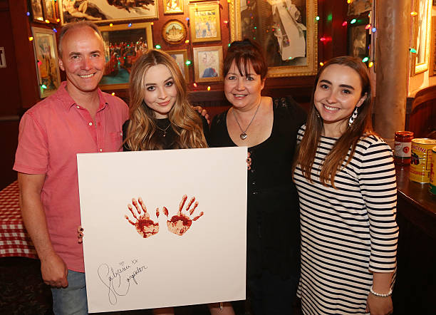 Sabrina Carpenter Poses with her Family as She Pro