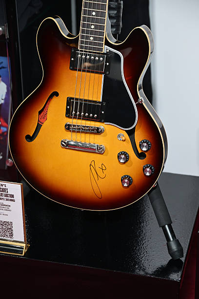 Shot of a Gibson ES-339 guitar signed by Sabrina Carpenter displayed at MusiCares charity relief auction at Los Angeles Convention Center on January 29, 2026 in Los Angeles, California. (408×612)