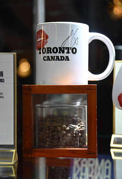 Shot of a mug used and signed by Sabrina Carpenter during a performances of her song "Espresso" displayed at MusiCares charity relief auction at Los Angeles Convention Center on January 29, 2026 in Los Angeles, California. (418×612)