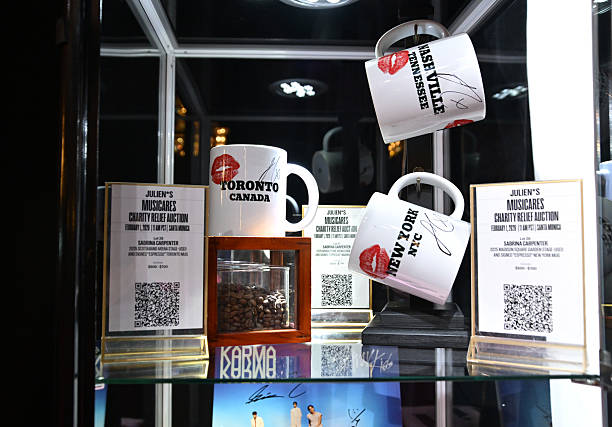 Shot of mugs used and signed by Sabrina Carpenter during performances of her song "Espresso" displayed at MusiCares charity relief auction at Los Angeles Convention Center on January 29, 2026 in Los Angeles, California. (612×427)