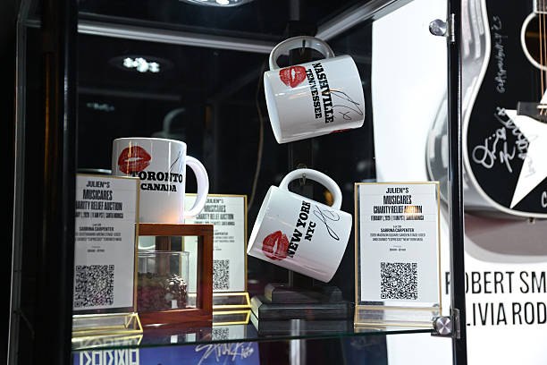 Shot of mugs used and signed by Sabrina Carpenter during performances of her song "Espresso" displayed at MusiCares charity relief auction at Los Angeles Convention Center on January 29, 2026 in Los Angeles, California. (612×408)